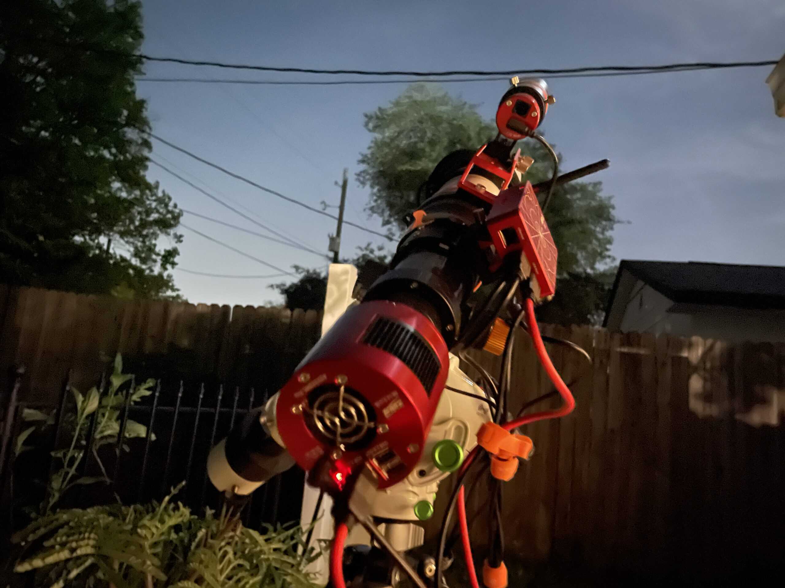Star Adventurer GTi mount and SV503 refractor set up in a Bortle 9 backyard for an overnight astrophotography session