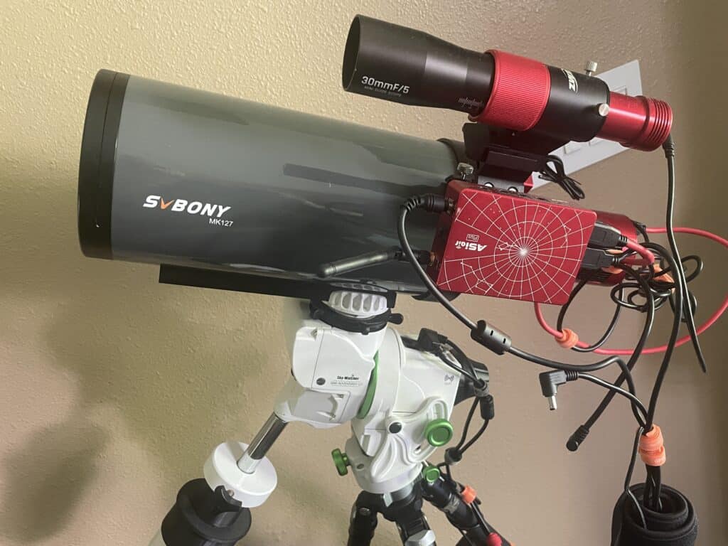 Astrophotography rig pre-assembled indoors on a Star Adventurer GTI mount, with guide scope and ASI Air Plus ready for a clear night